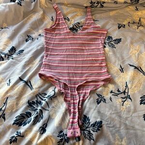 Pink, purple, blue and white striped tank top bodysuit